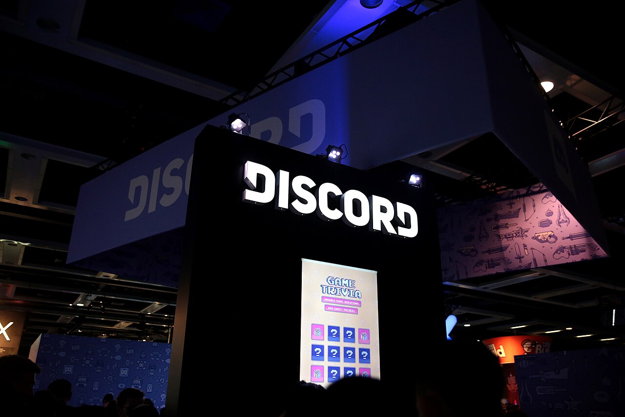 Discord signs above the company booth at PAX West in 2018.
